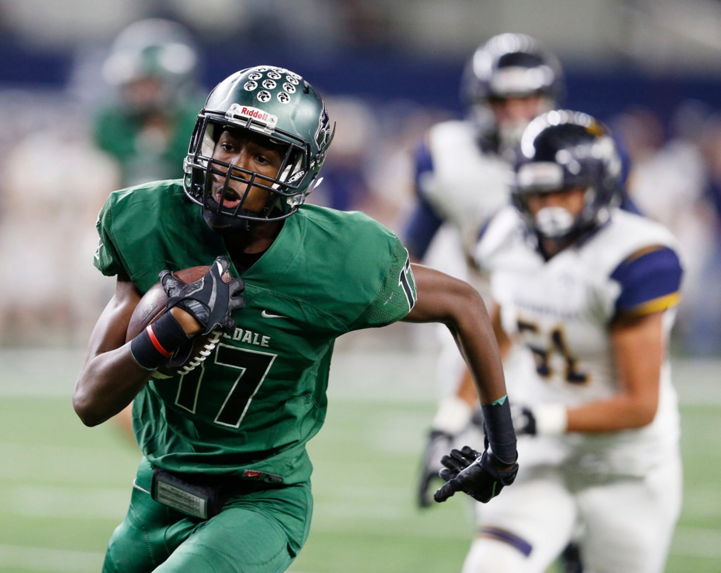 Kennedale's Jaden Smith (17) runs after the catch for a touchdown in a game against...