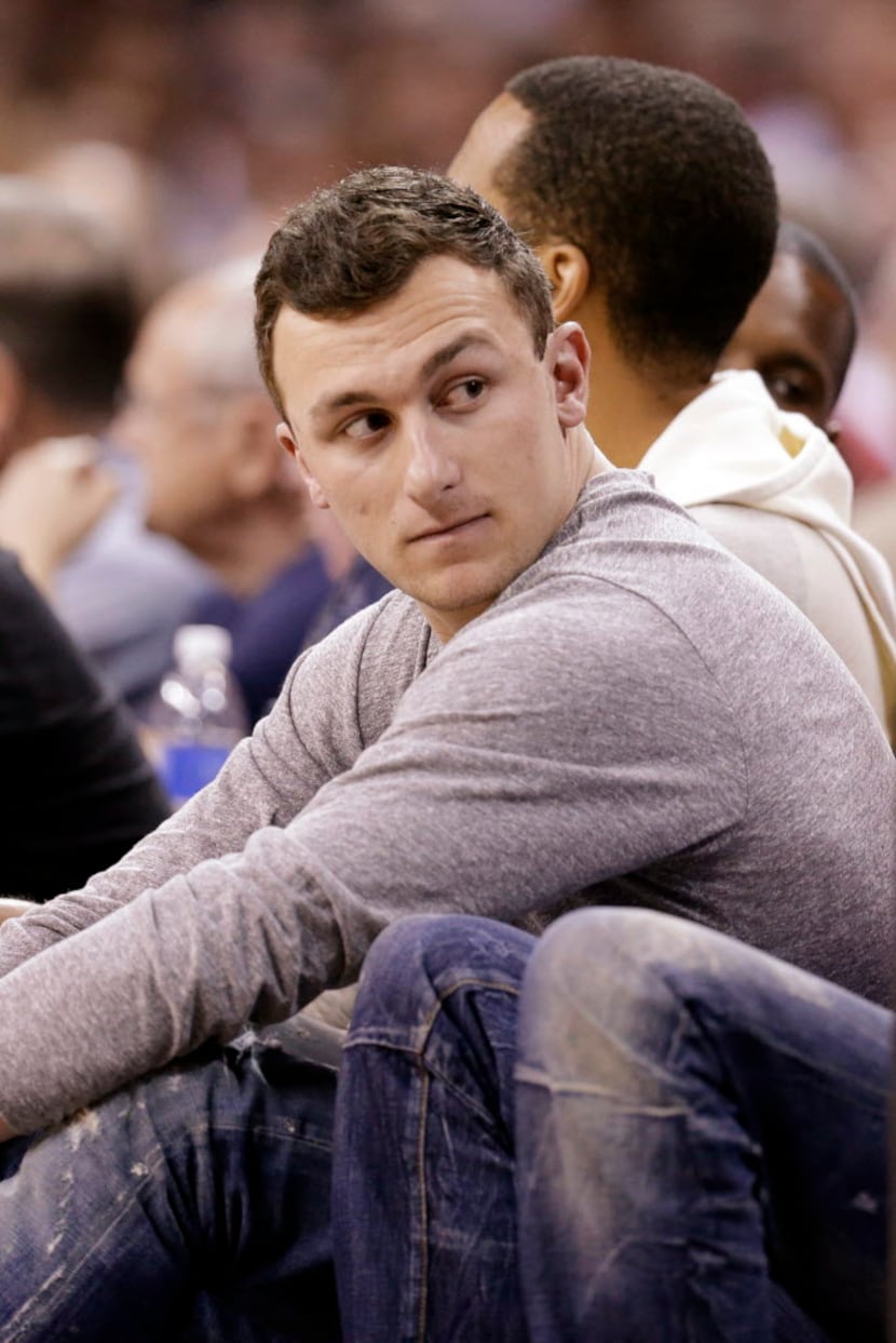 Cleveland Browns quarterback Johnny Manziel watches in the second quarter of a first round...