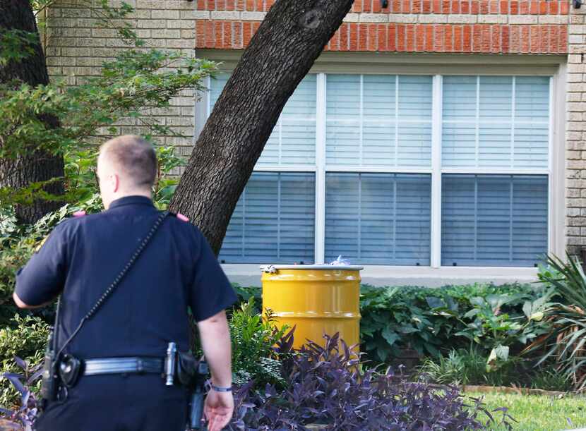 A barrel for disposal of hazardous waste sits outside the residence at 5700 block of ...