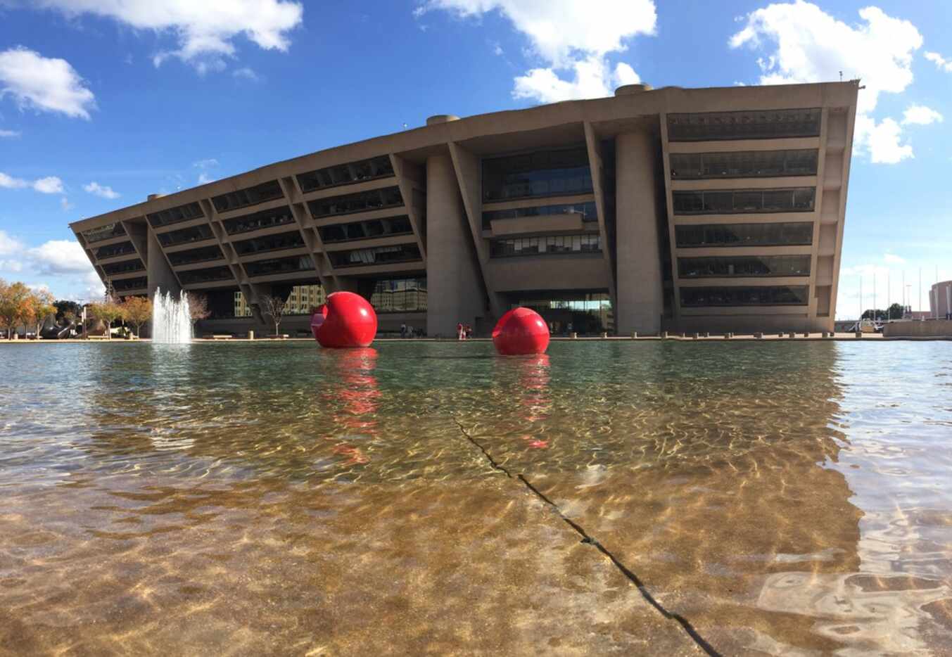 The wind ripples the reflection pond in front of the Dallas City Hall on Nov. 4, 2018. 