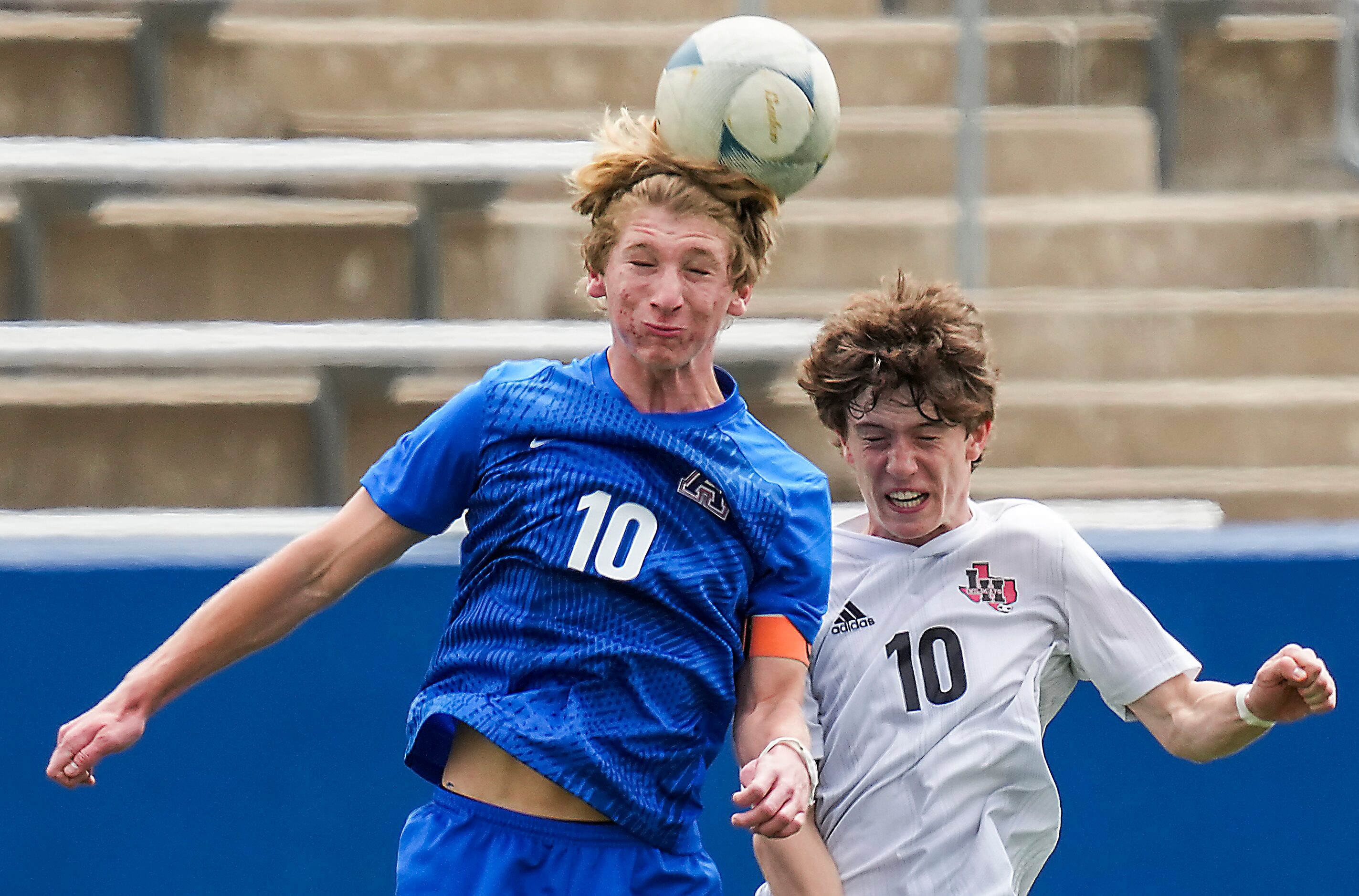 Allen midfielder Evan Pustejovsky wins a header against Lake Highlands forward Mitch...