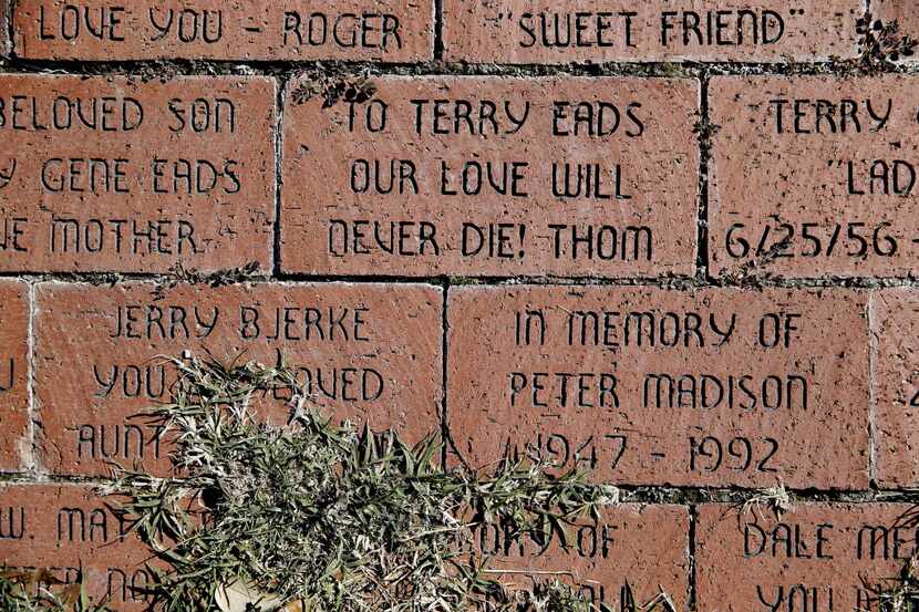 Bricks remain in memorial for those from the Resource Center community who died from...