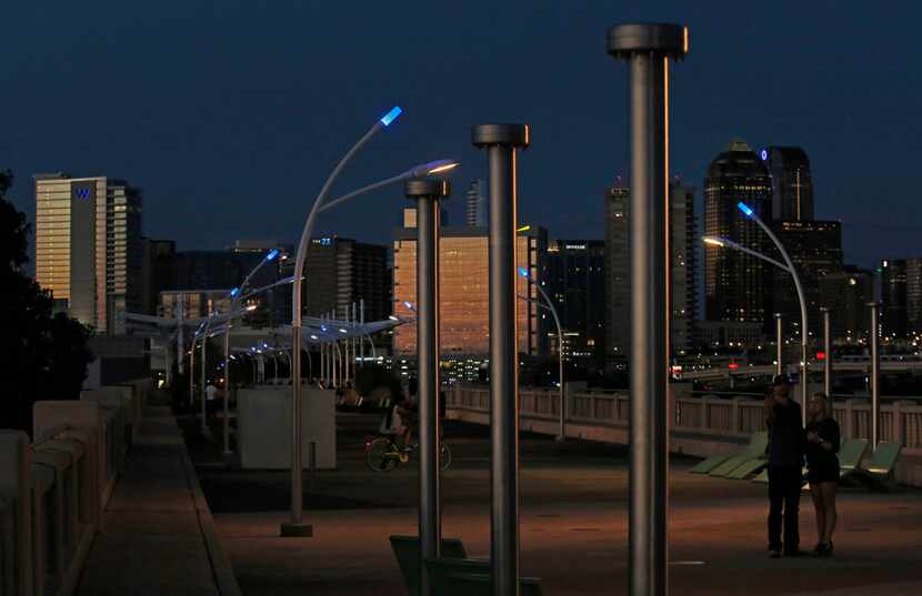 Blue LEDs sit atop the streetlights around the Trinity River at the Ronald Kirk Pedestrian...