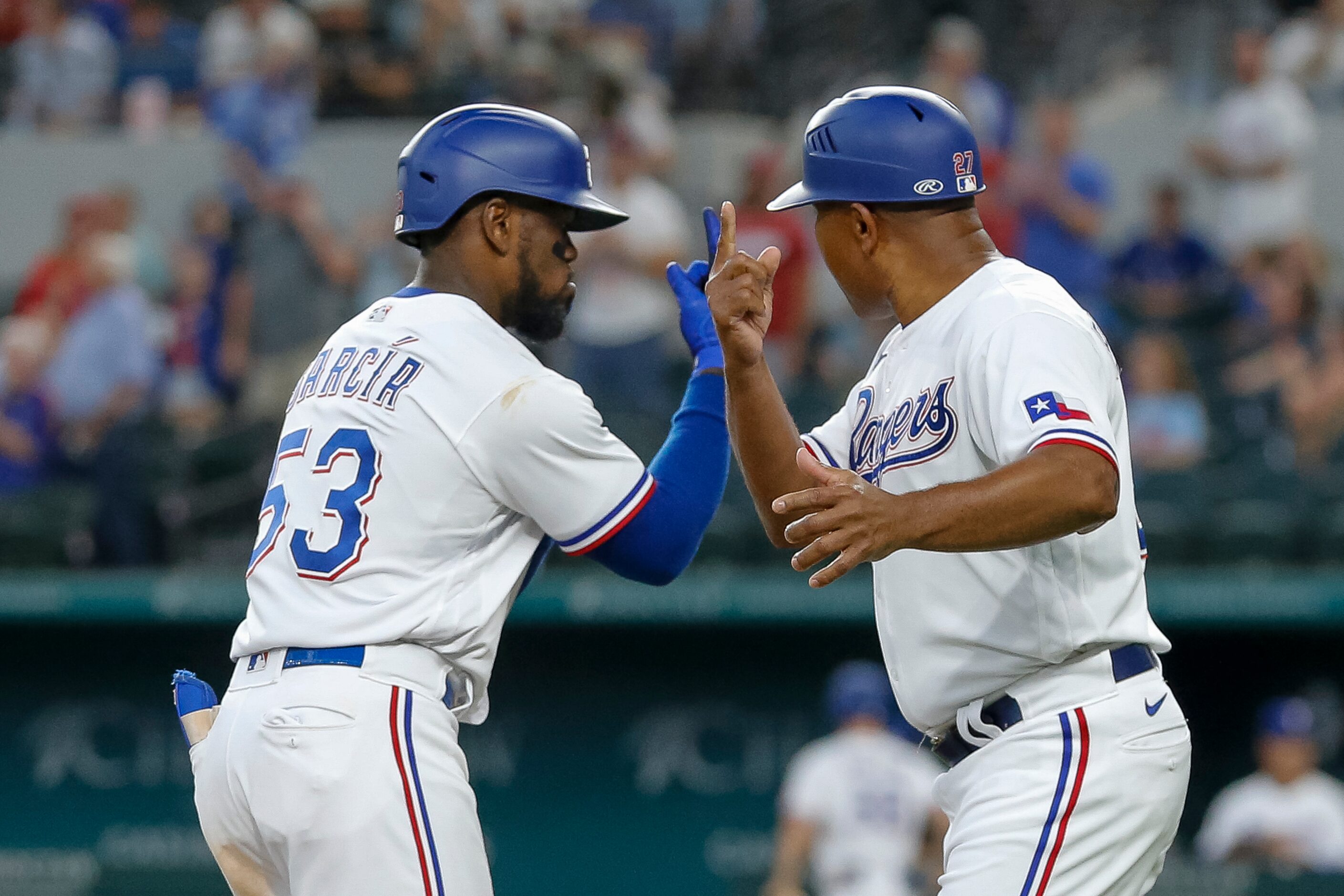 Texas Rangers right fielder Adolis Garcia (53) celebrates with Texas Rangers third base...