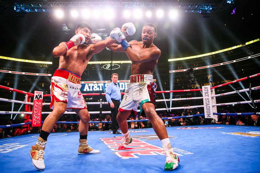 Mikey Garcia and Errol Spence Jr. box during the first round of a IBF World Welterweight...