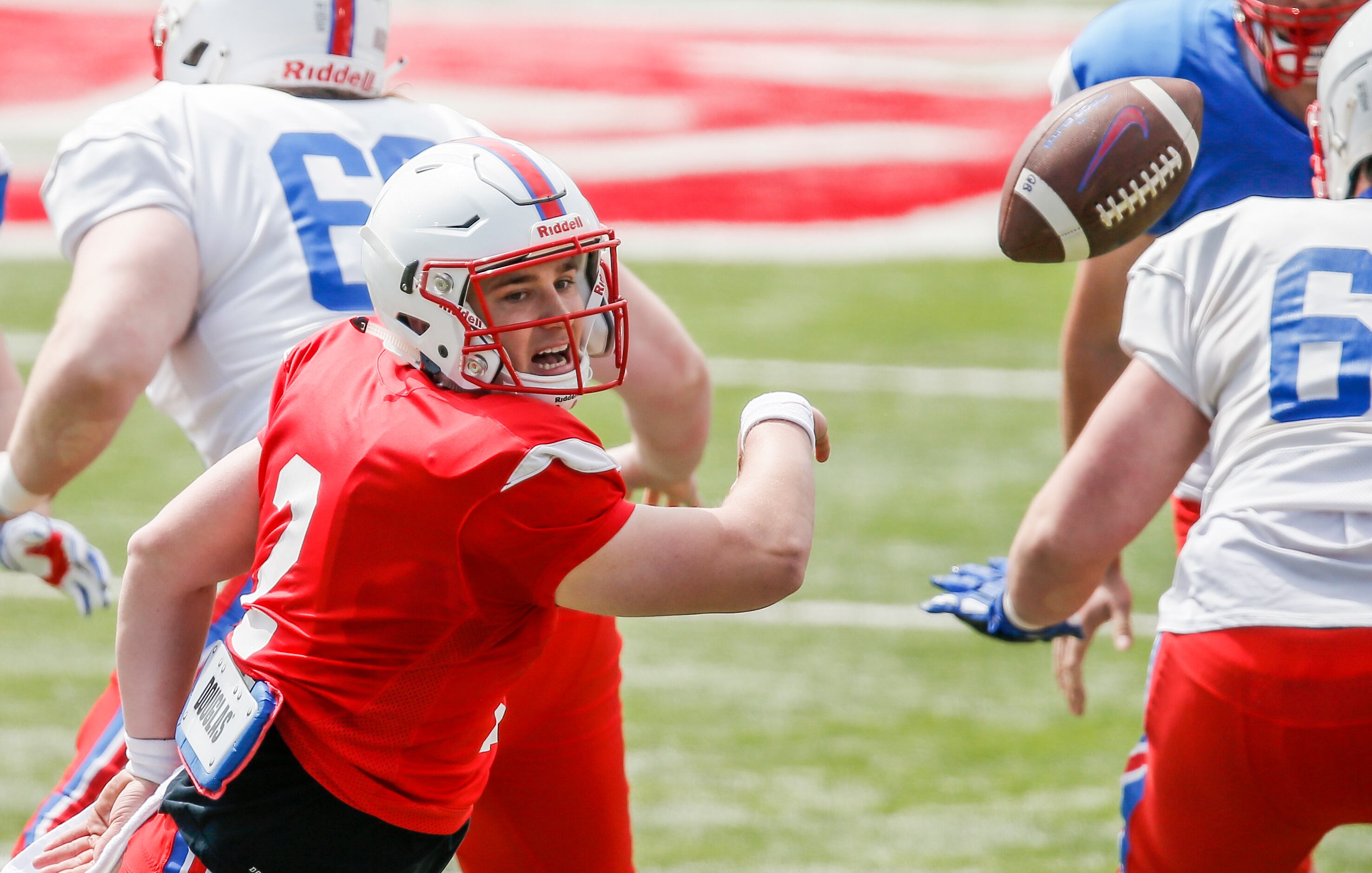 SMU quarterback Josh Stupin (2) reaches for a bad snap during practice at Gerald Ford...