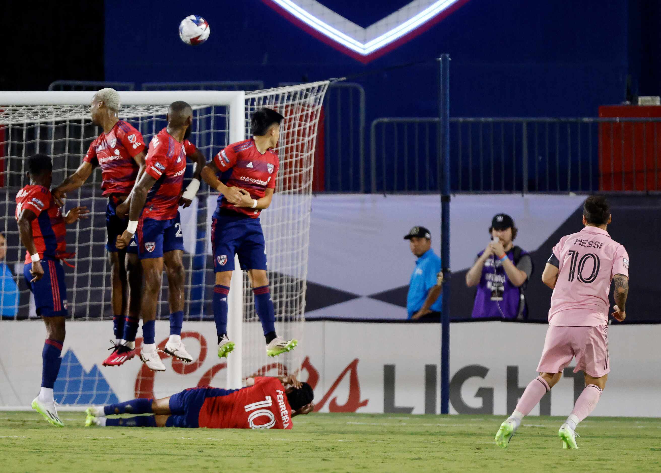 Inter Miami forward Lionel Messi (10) scores over the FC Dallas defense on a free kick...