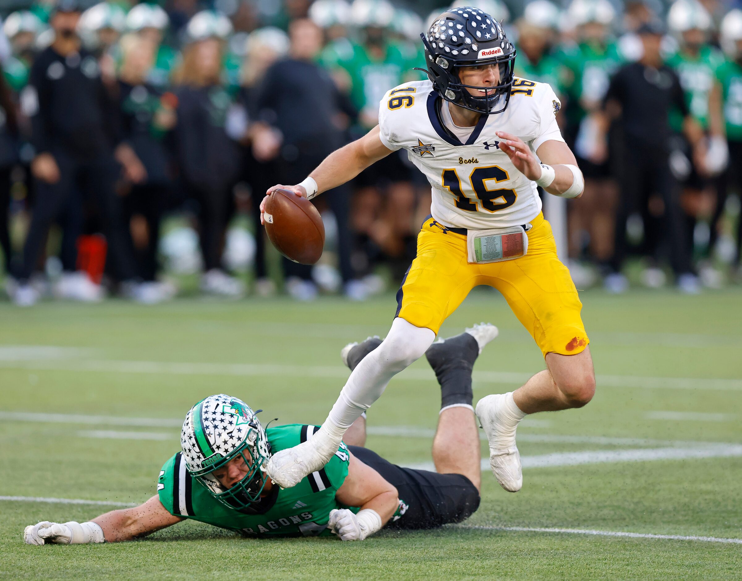 Southlake Carroll defensive lineman Dustan Mark (44) attempts to tackle Highland Park...