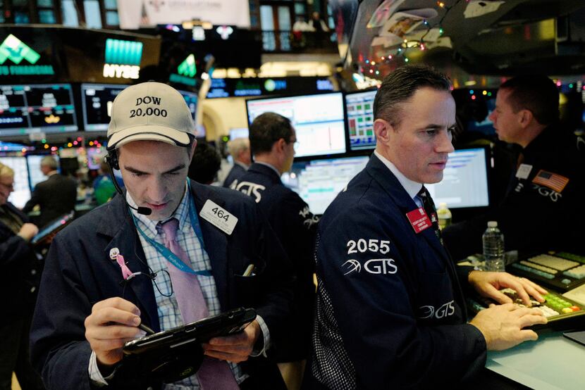 Traders work at the New York Stock Exchange, Thursday, Dec. 22. (AP Photo/Mark Lennihan)