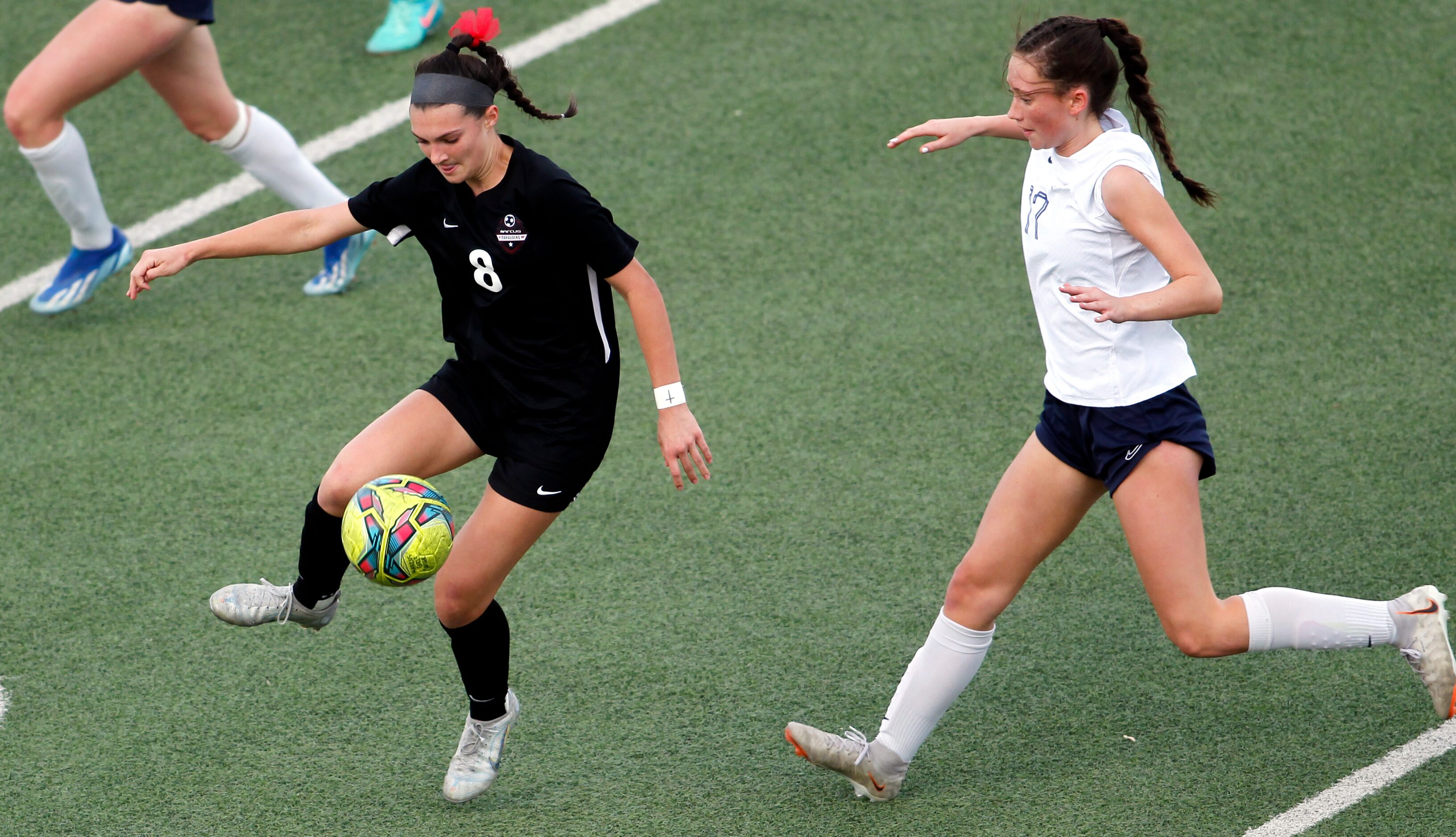 Flower Mound Marcus midfielder Emma Fioretti (8) negotiates a pass as Richardson JJ Pearce...