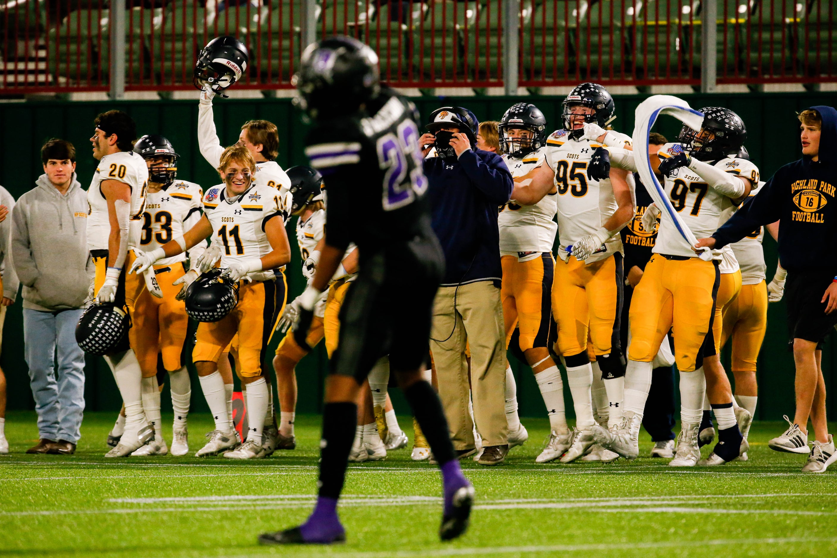 Highland Park players watch the second half of a Class 5A Division I area-round playoff game...