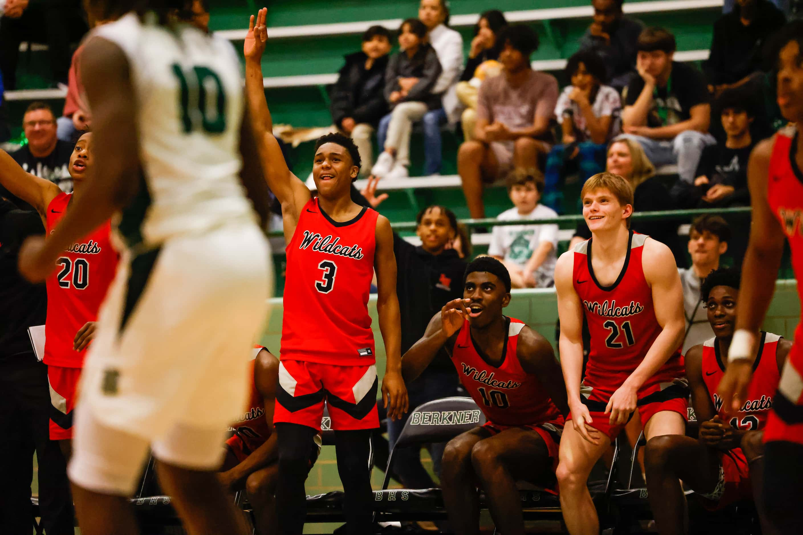 Lake Highlands High School team celebrates a 3 points during a game against Berkner High...