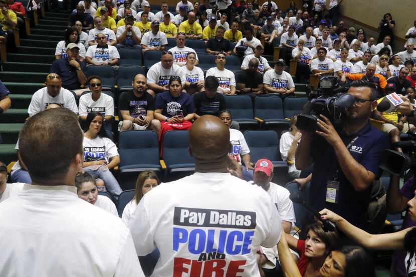 Leaders speak to Dallas police officers and first responders after a meeting at Dallas City...