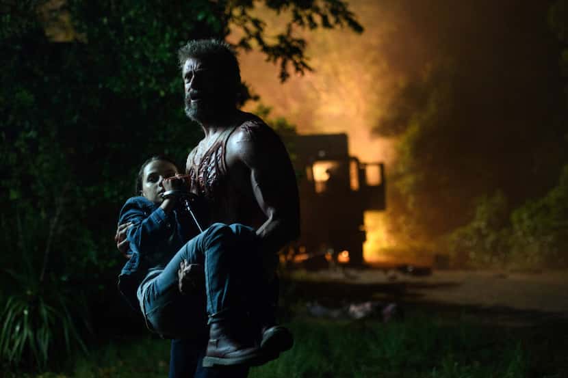 This image released by Twentieth Century Fox shows Dafne Keen, left, and Hugh Jackman in a...