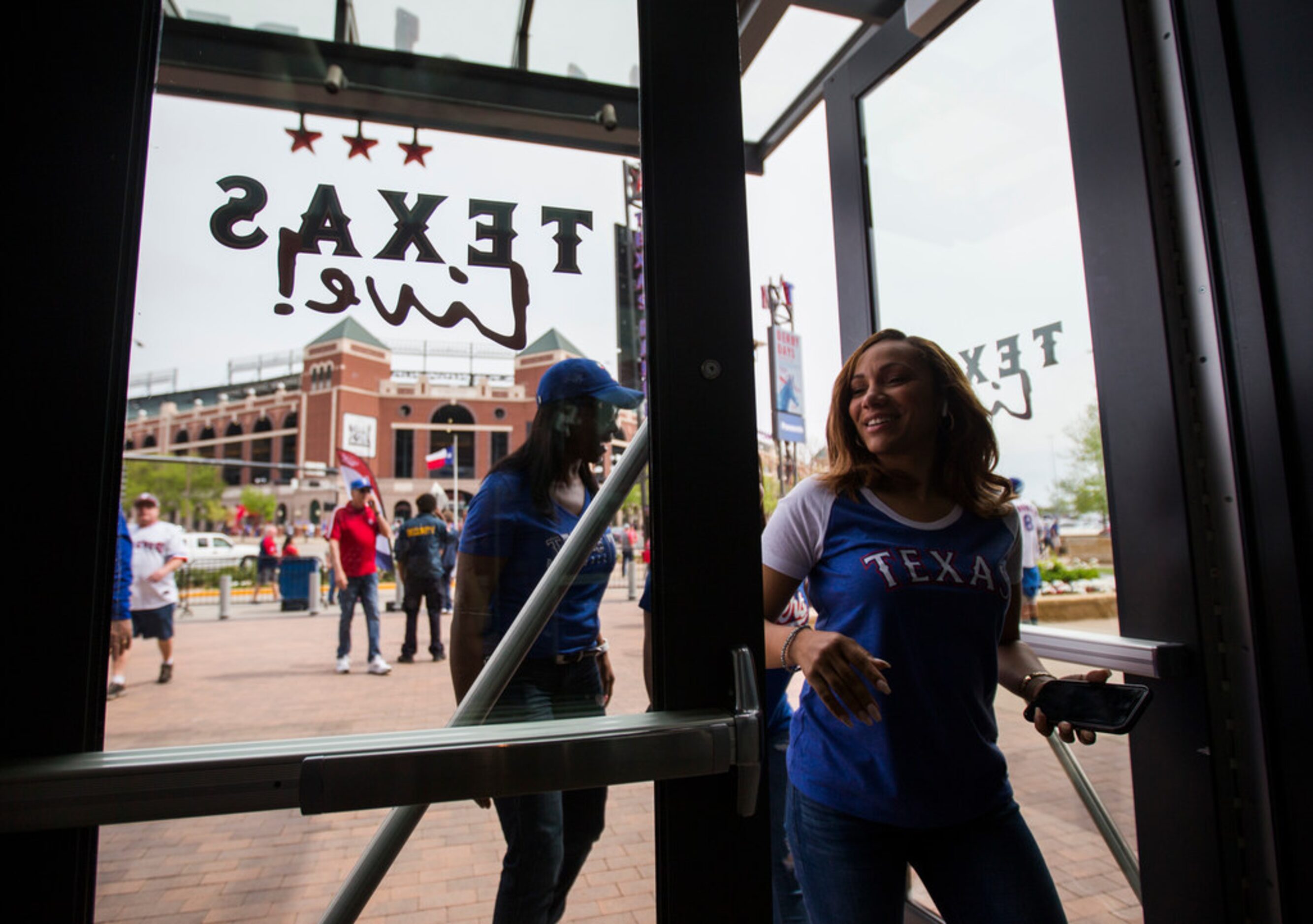 Fans enter Texas Live! across the street from Globe Life Park before Texas Rangers Opening...