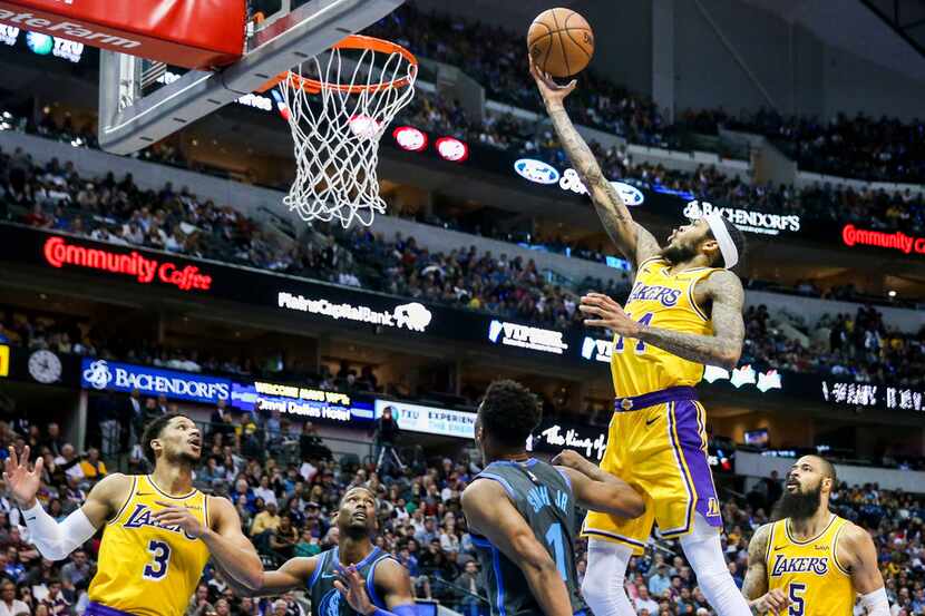 Los Angeles Lakers forward Brandon Ingram (14) goes up for two over Dallas Mavericks forward...