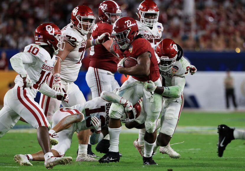 MIAMI, FL - DECEMBER 29:  Najee Harris #22 of the Alabama Crimson Tide carries the ball...