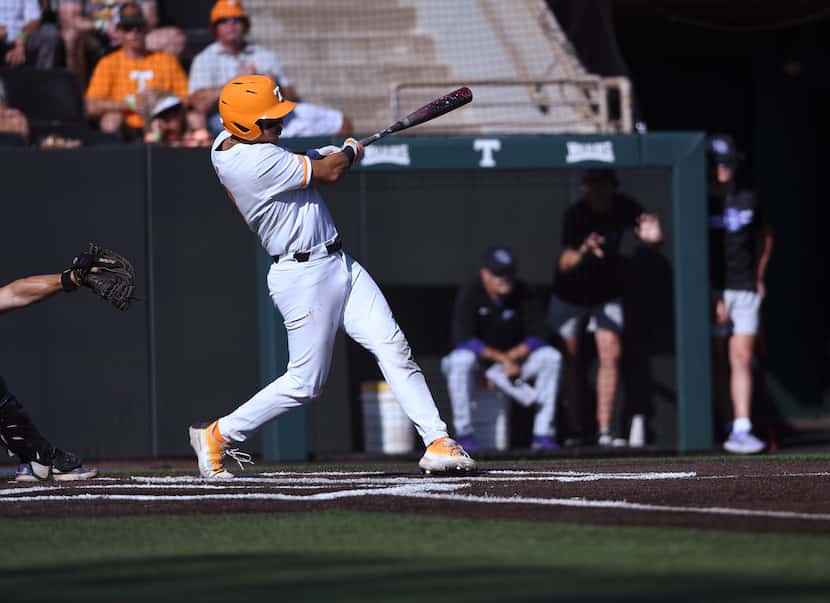 Tennessee's Hunter Ensley (9) hits a home run against Evansville during the seventh inning...