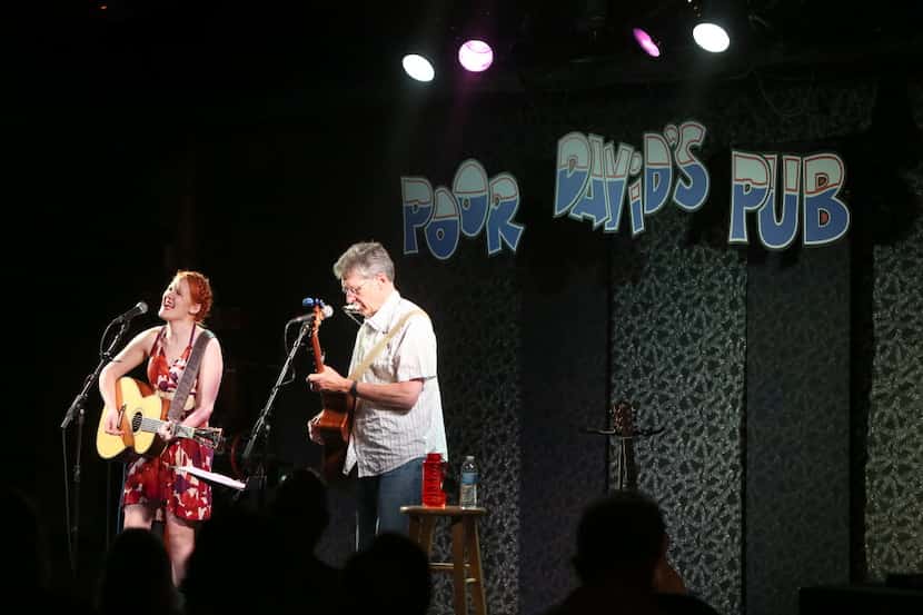 Grace Pettis performs with her father, Pierce Pettis, at Poor David's Pub in Dallas, Texas...