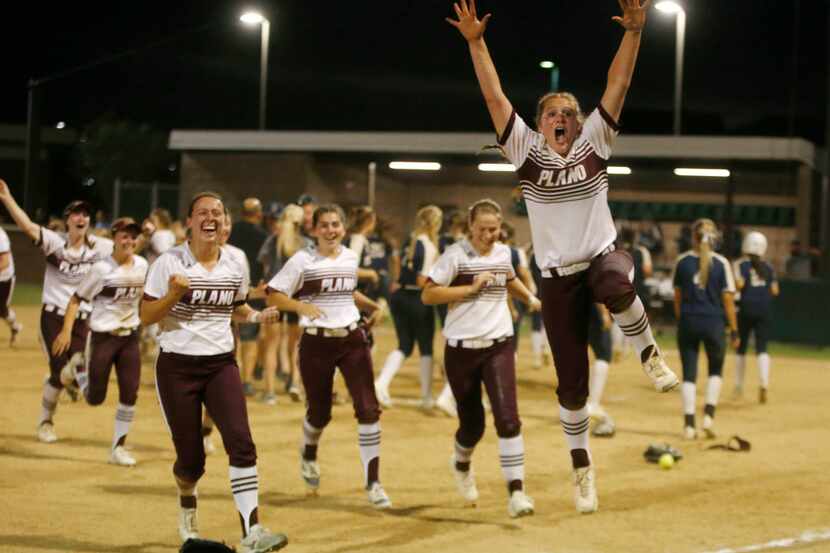 Plano celebrates after beating Keller 2-1 during their softball game at Tina Minke Field in...