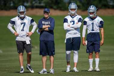 Dallas Cowboys quarterbacks coach Kellen Moore watches with quarterbacks Cooper Rush (7),...