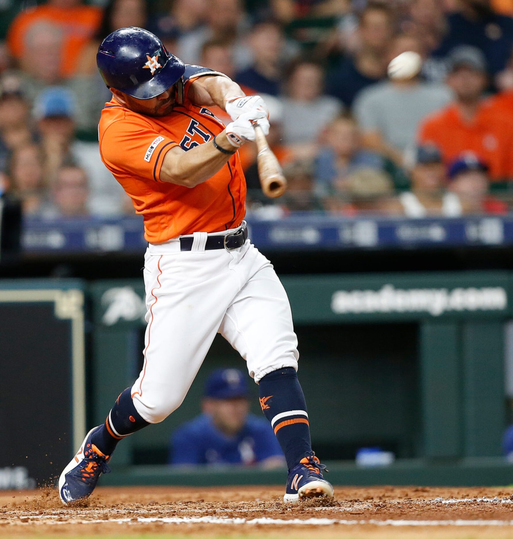 HOUSTON, TEXAS - JULY 19: Jose Altuve #27 of the Houston Astros hits a home run in the third...