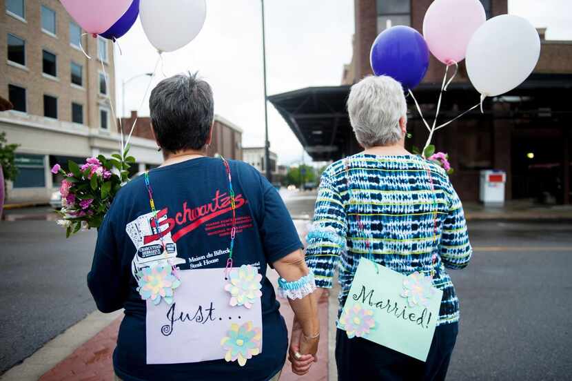 Barb Sonderman  (left) and her partner of 17 years, Martha Pickens, walked together as a...