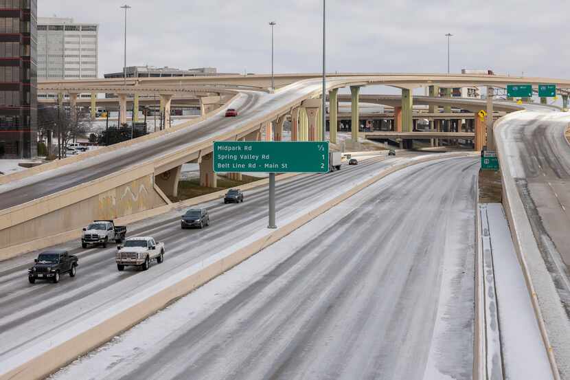 Motorists travel southbound on U.S. 75 through the High Five interchange at I-635 on Friday,...