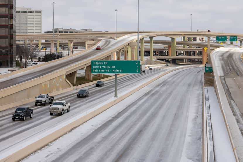 Motorists travel southbound on U.S. 75 through the High Five interchange at I-635 on Friday,...