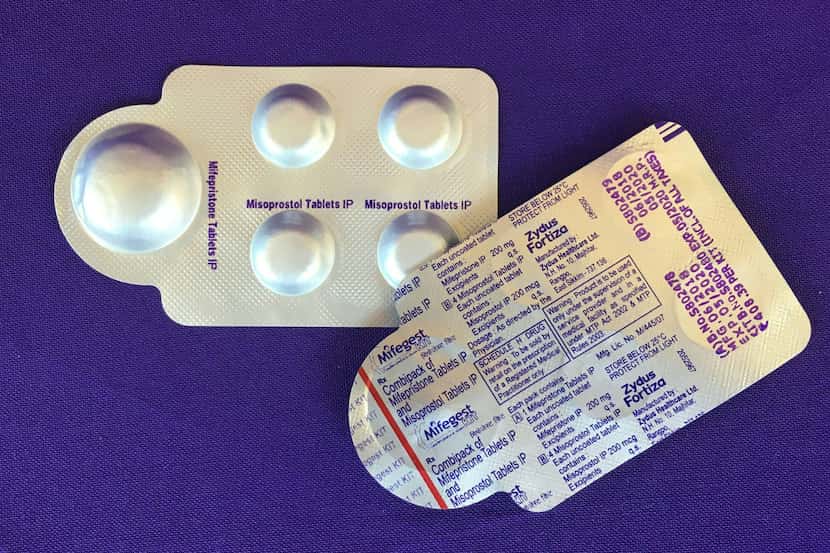 Image dated May 8, 2020, shows a combination pack of mifepristone, left, and misoprostol...