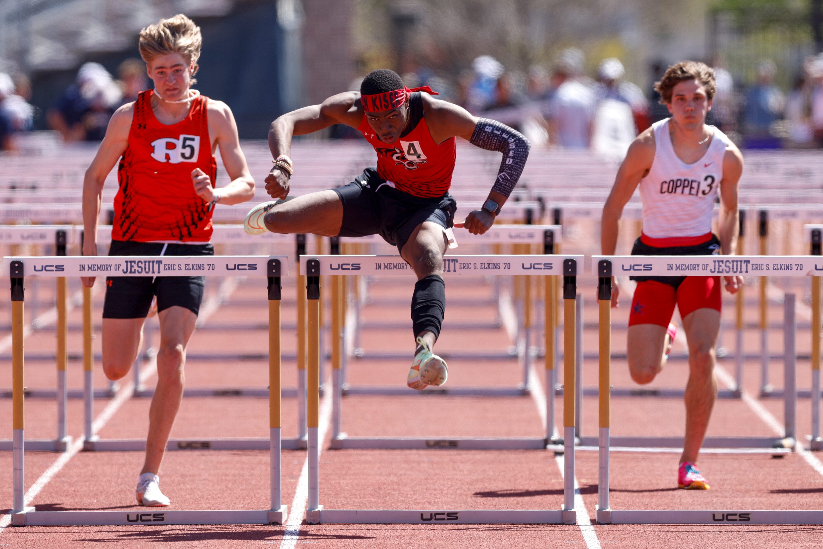 Denton Braswell’s Austin Kiser (center) leads Rockwall’s Collin McCrillis (left) and...