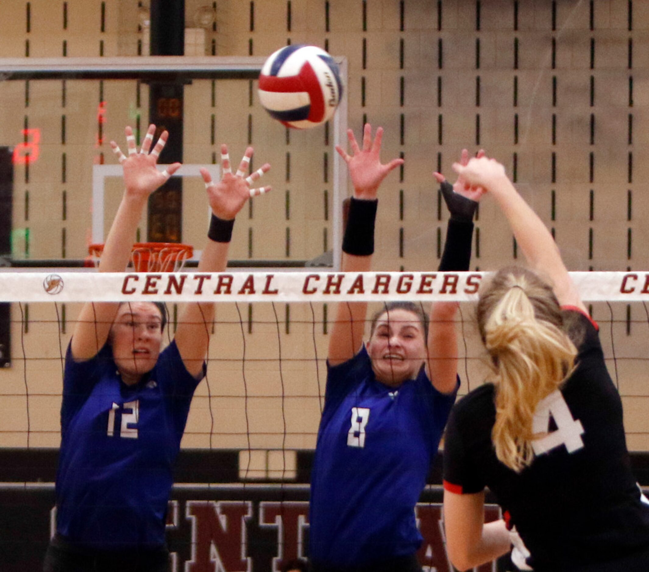 Coppell's Peyton Minyard (4) tries to split the defense of Trophy Club Byron Nelson...