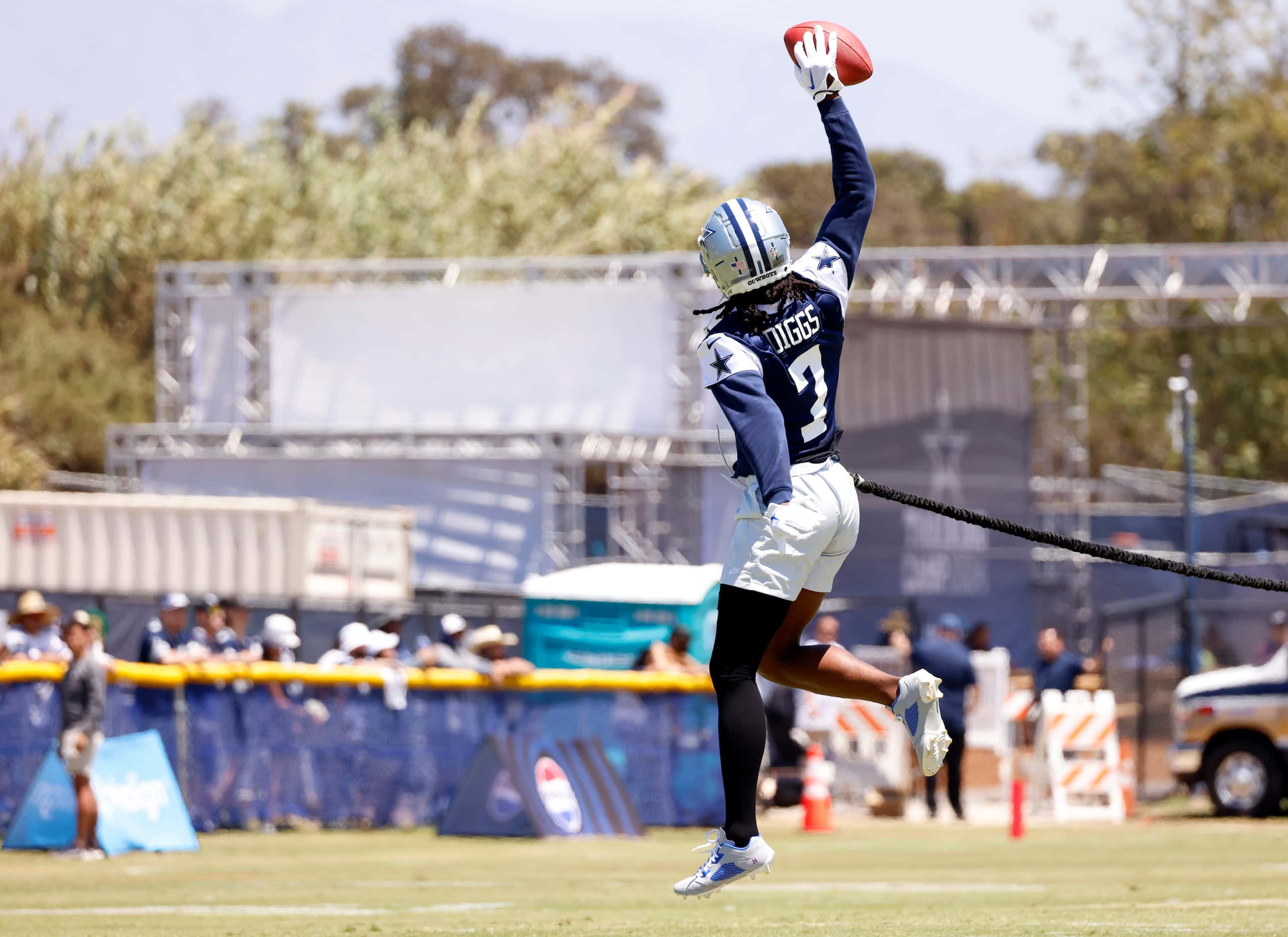 Dallas Cowboys cornerback Trevon Diggs (7) makes a one-handed catch while attached to an...