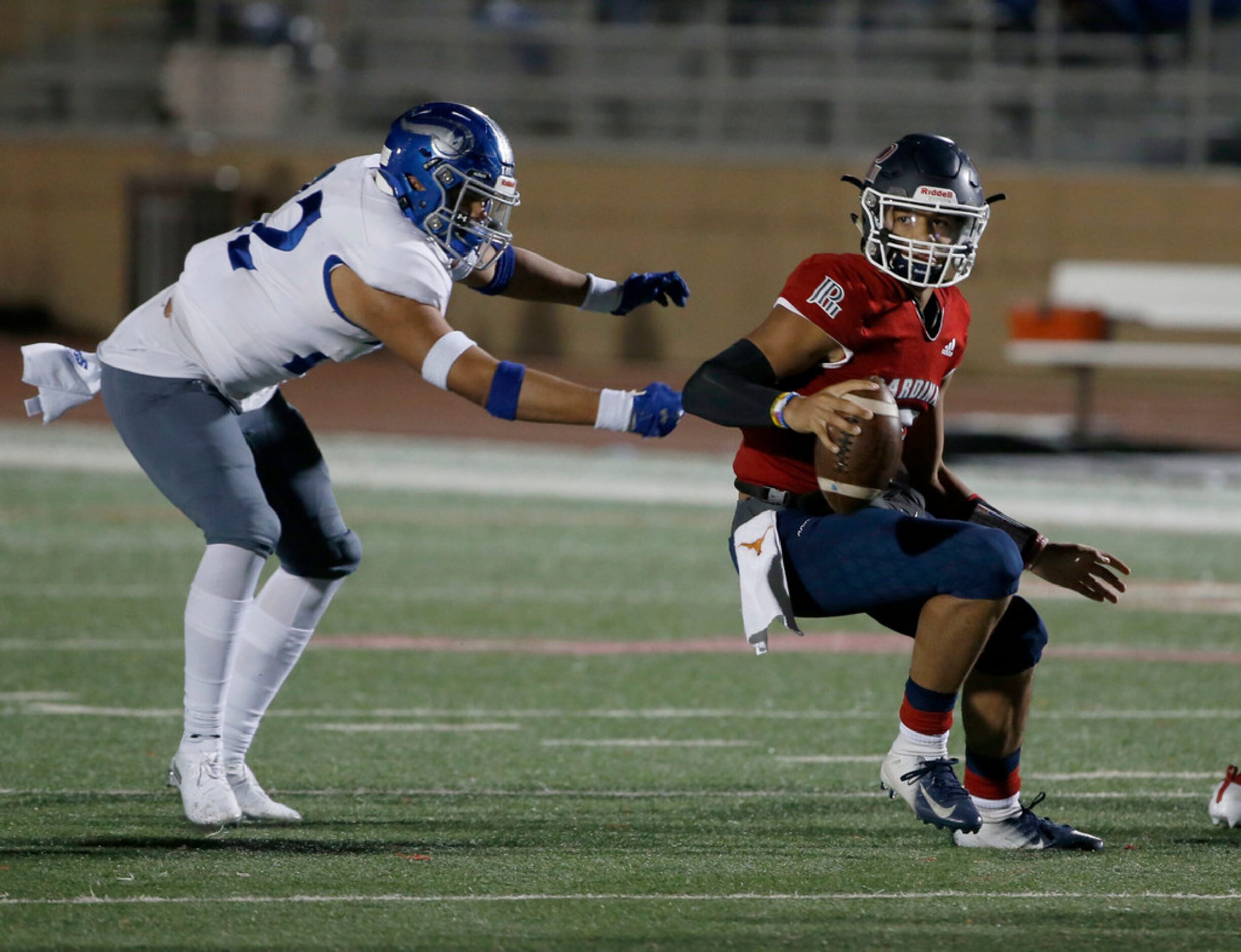 John Paul II quarterback  Grayson James, right, gets away from Nolan defender Frankie Romero...