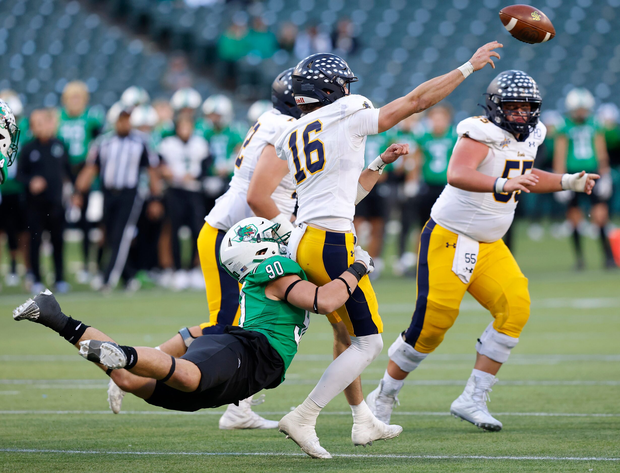 Southlake Carroll’s Austin Davidge (90) tackles Highland Park quarterback Parker Thompson...