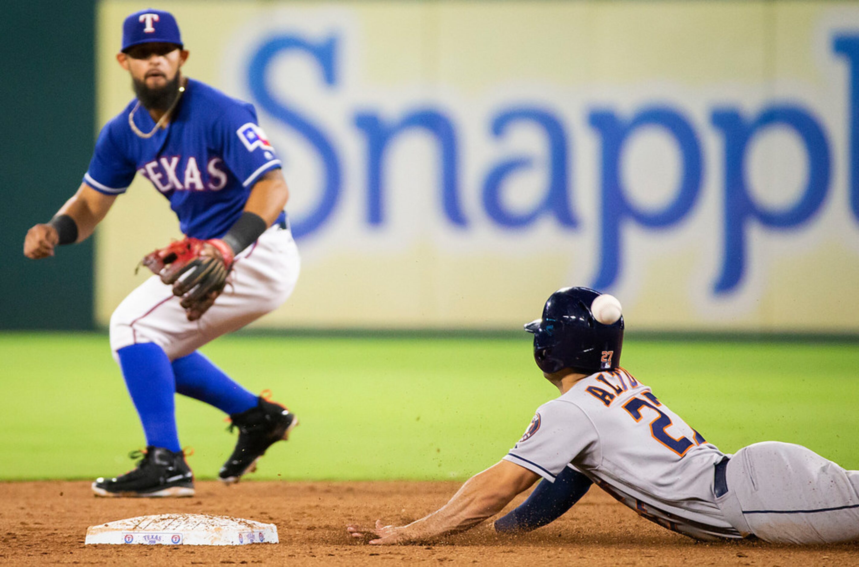 Houston Astros second baseman Jose Altuve is safe at second base with a stolen base as the...