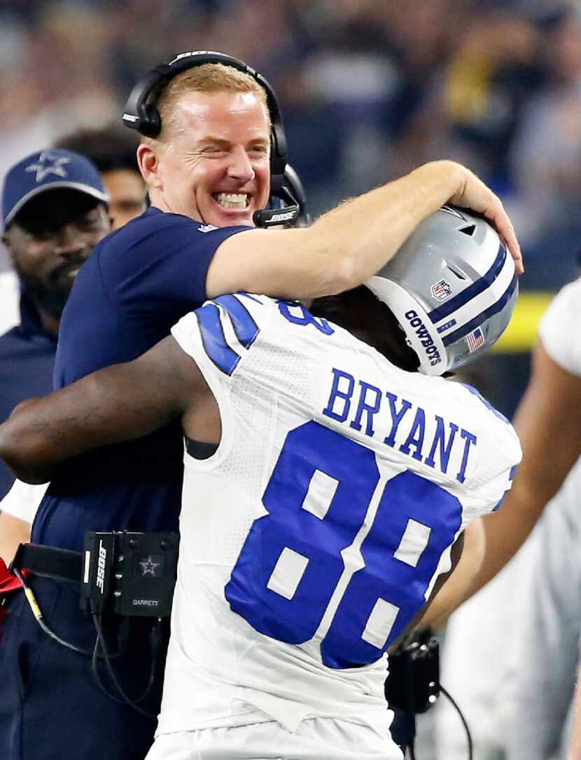 Cowboys head coach Jason Garrett (left) congratulates wide receiver Dez Bryant after Bryant...
