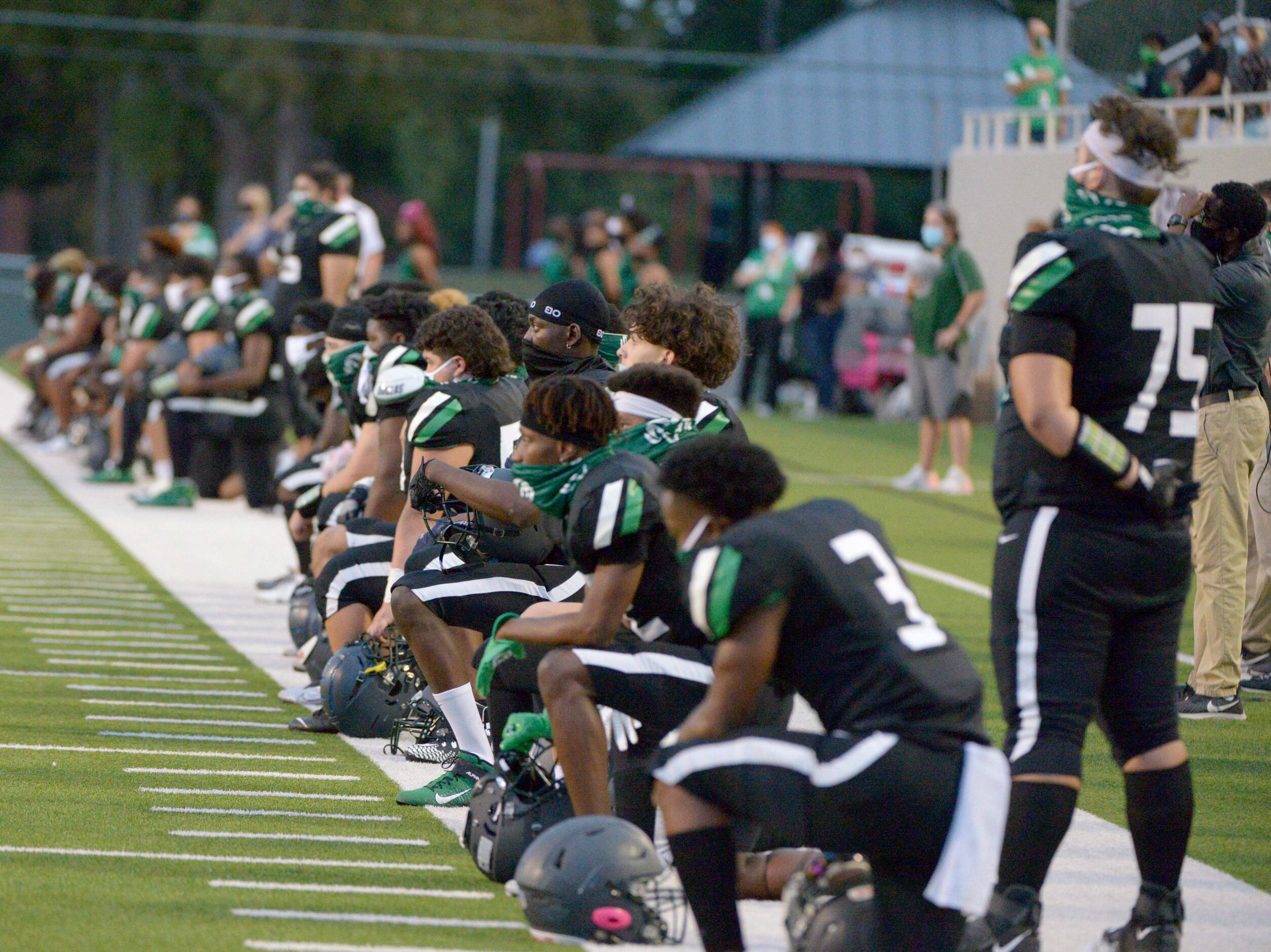 Richardson Berkner players during the National Anthem before a high school football game...