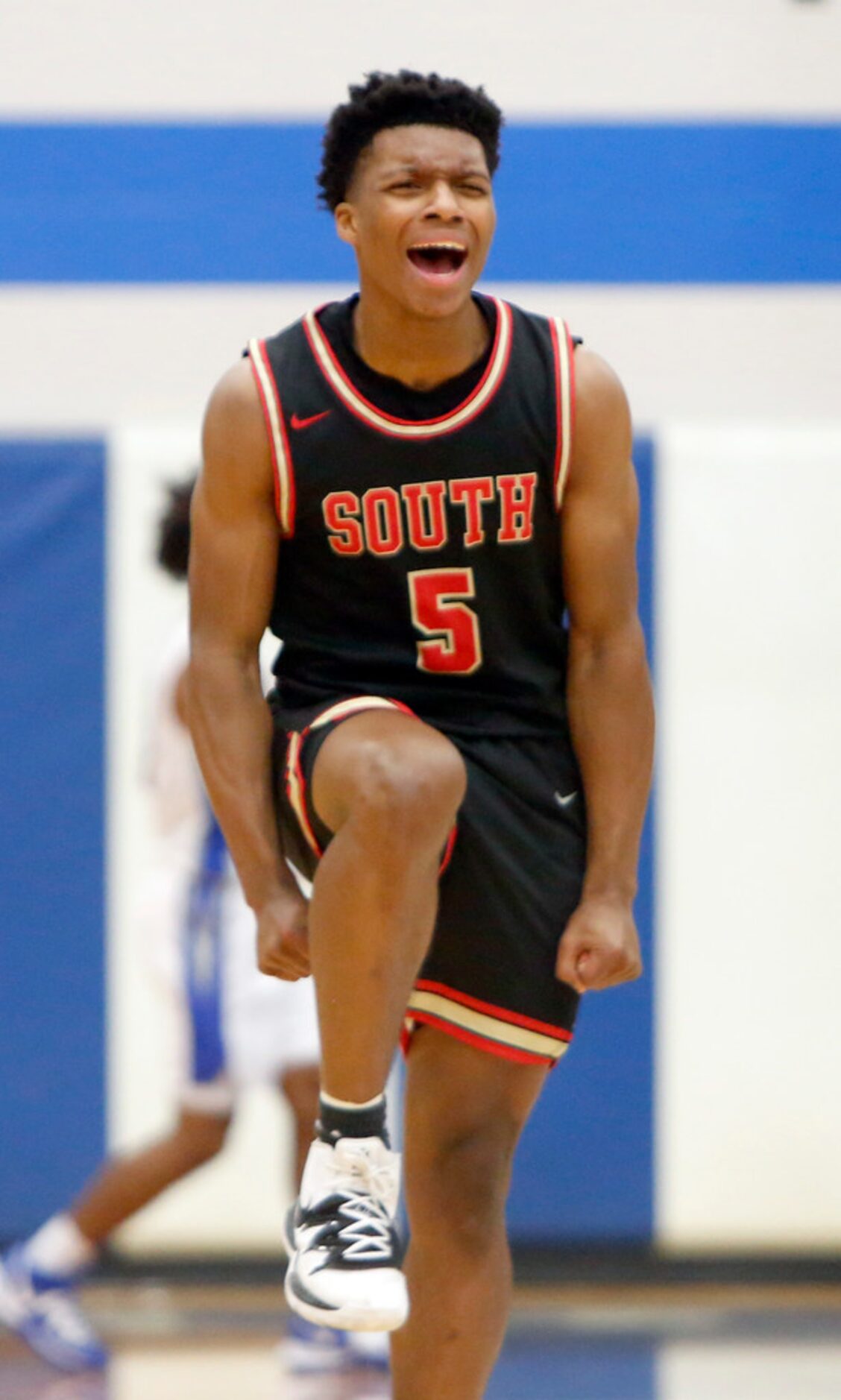 South Grand Prairie guard Jalen Griffin (5) celebrates after hitting a 3-pointer during...