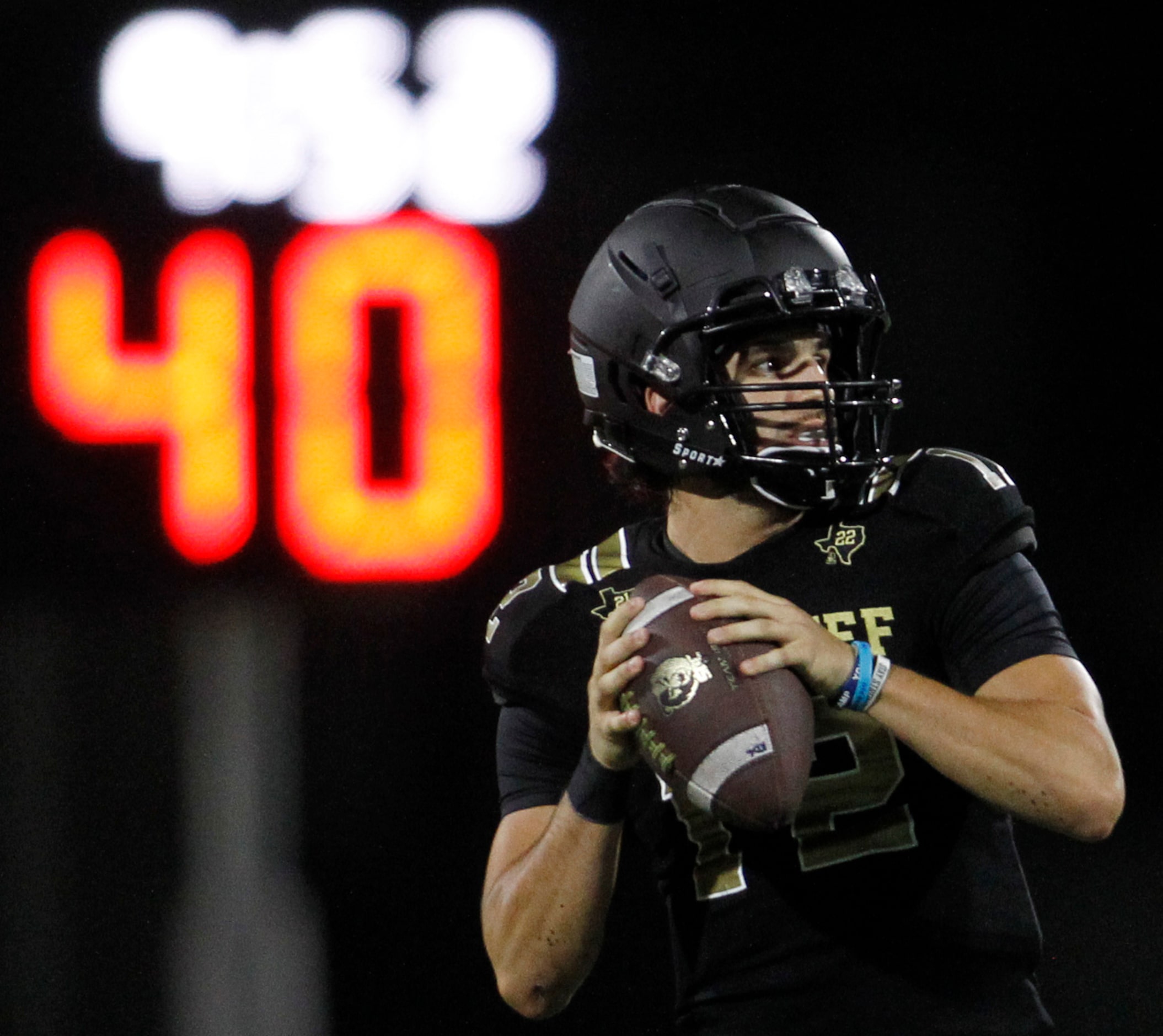 South Oak Cliff quarterback Carter Kopecky (12) looks to pass during first half action...