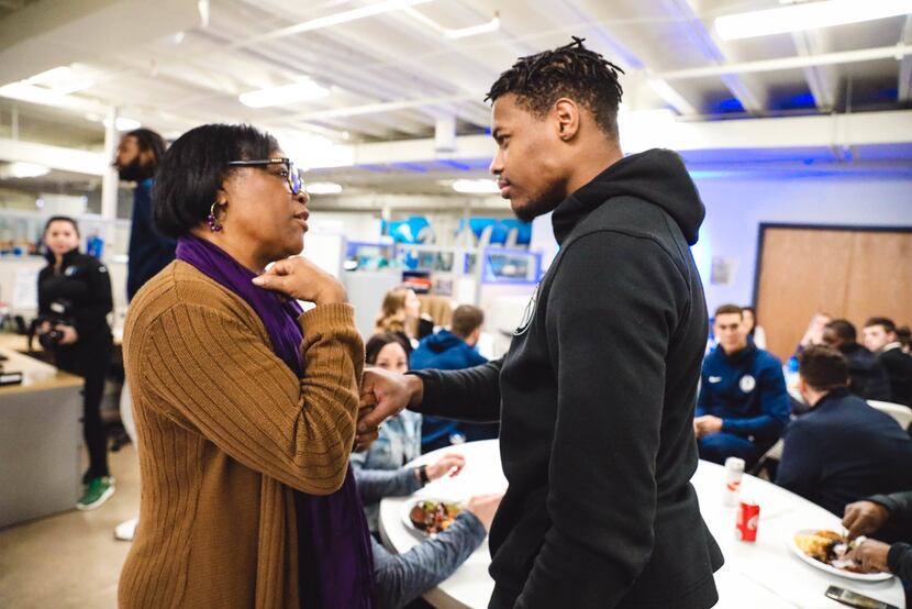 Mavericks CEO Cynthia Marshall and point guard Dennis Smith Jr. share a private moment...