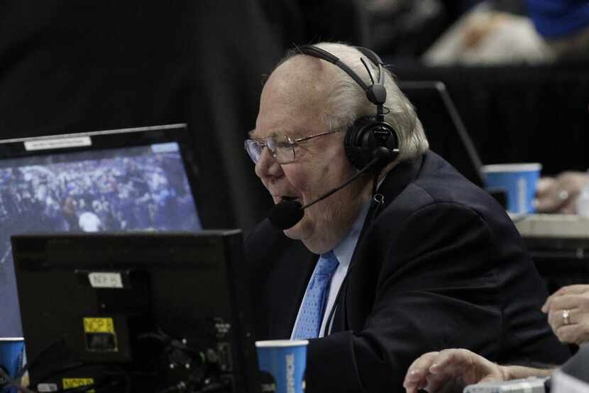 Mar 20, 2014; Buffalo, NY, USA;  Sportscaster Verne Lundquist works in the second half of a...