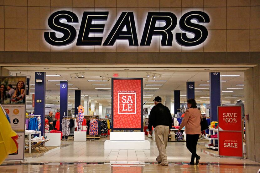 FILE - In this Wednesday, Feb. 8, 2017, file photo, shoppers walk into a Sears store in...