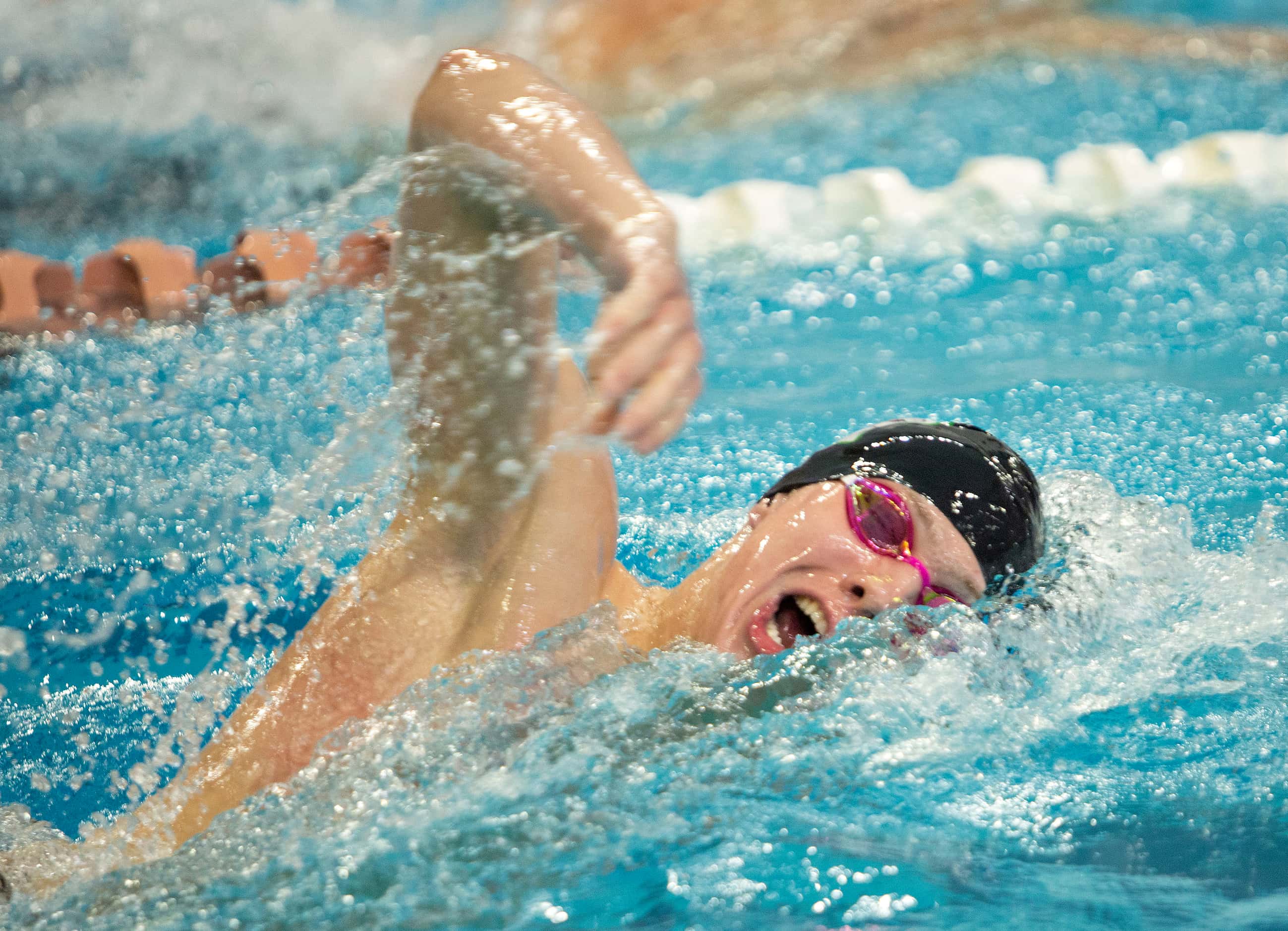 Southlake Carroll's Max Hatcher competes in the boys 500-yard freestyle race during the 6A...