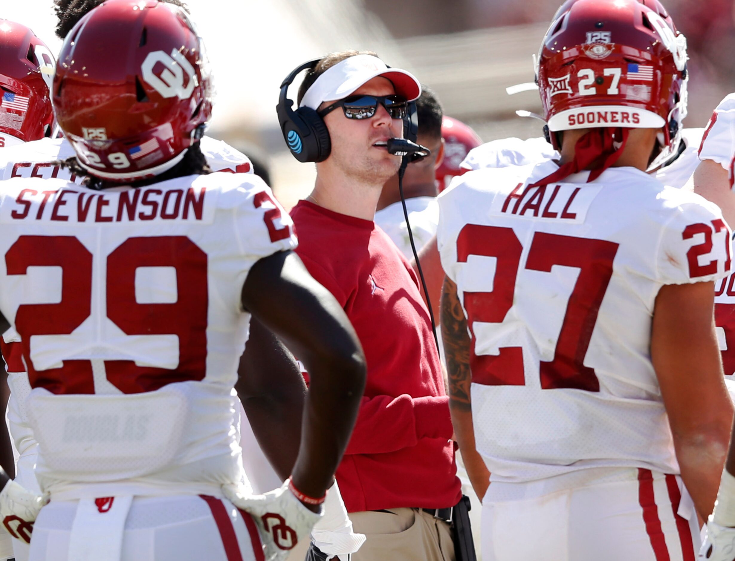 Oklahoma Sooners head coach Lincoln Riley looks at the replay in a game against Texas...