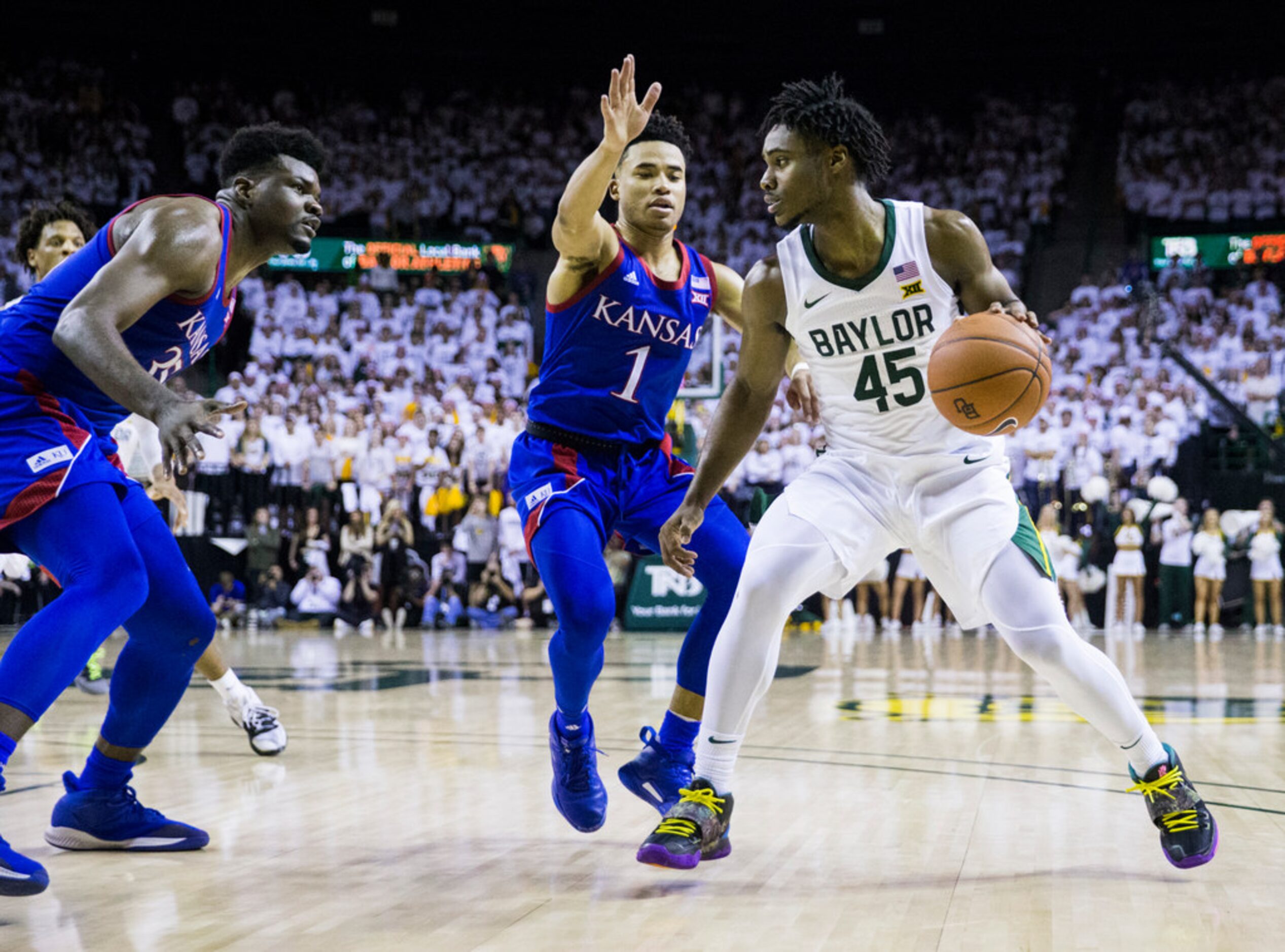 Baylor Bears guard Davion Mitchell (45) drives to the hoop against Kansas Jayhawks center...