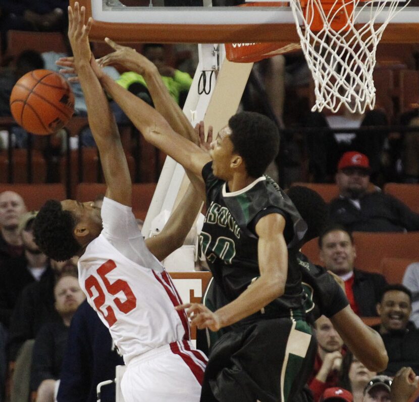 Desoto forward Devin Wyatt (20) defends a shot by Galena Park North Shore's Jarrey Foster...