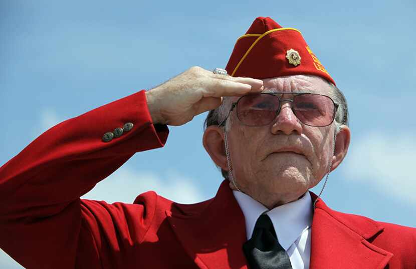  Gary McCurley, of Mesquite, Texas, salutes during the 21-gun salute at the Memorial Day...