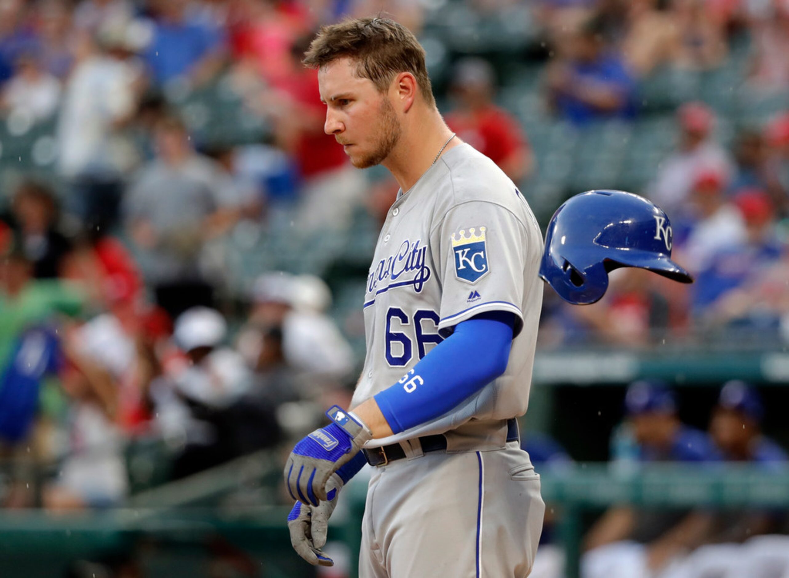 The helmet of Kansas City Royals' Ryan O'Hearn (66) bounces after he slammed it onto the...