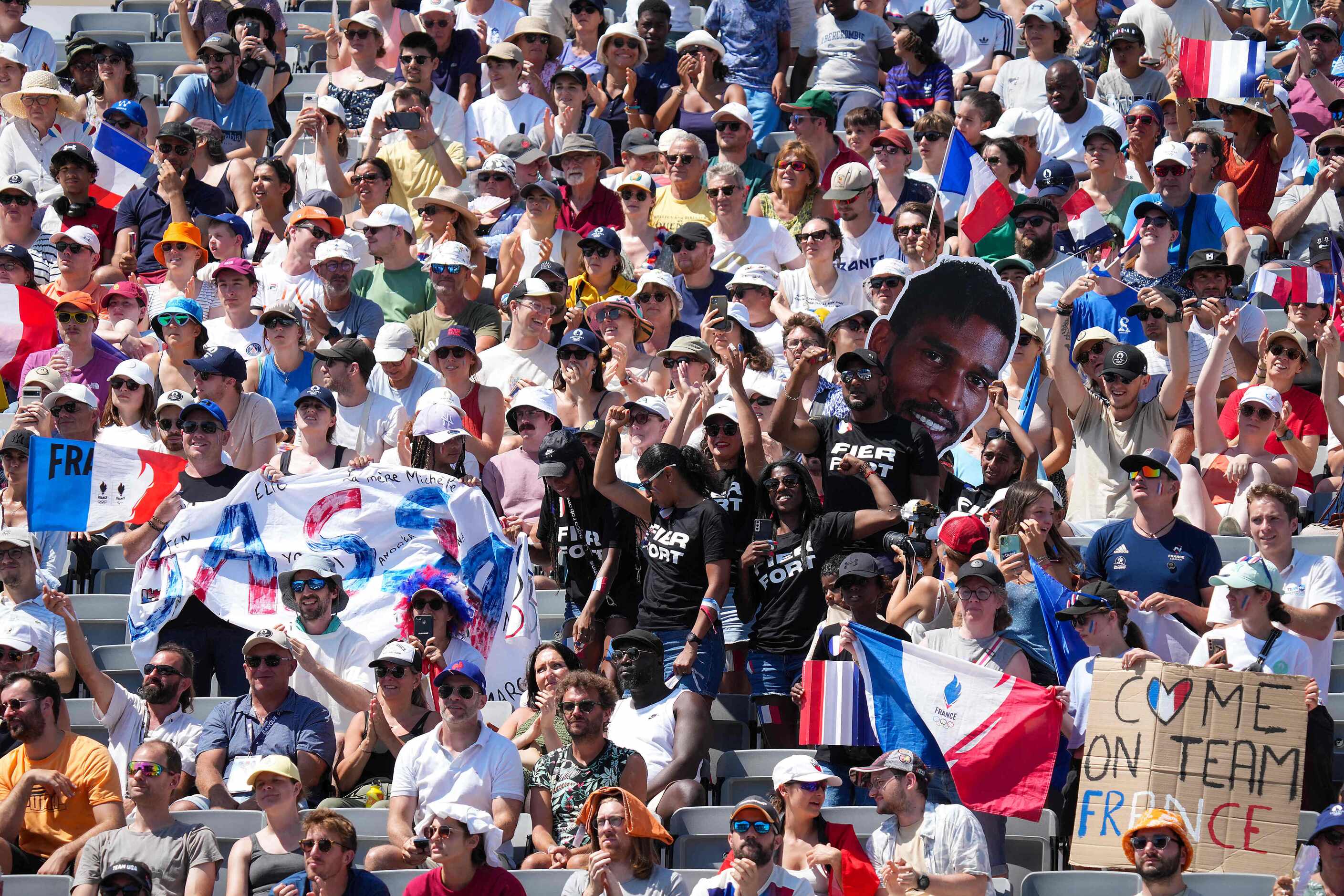 Fans cheer Bassa Mawem of France as he climbs against Yaroslav Tkach of Ukraine during men’s...